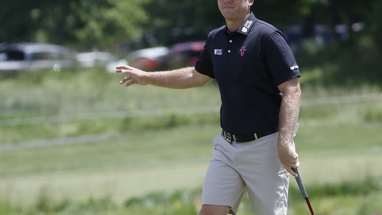 May 25, 2023; Washington, DC, USA; Talor Gooch waves to fans after making a putt on the second hole during the first round of the LIV Golf DC 2023 tournament at Trump National Golf Club in Sterling, Va. Mandatory Credit: Geoff Burke-USA TODAY Sports