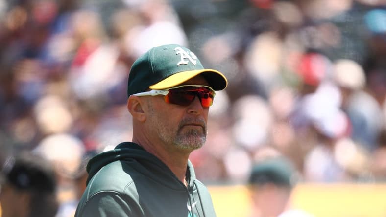 May 31, 2023; Oakland, California, USA; Oakland Athletics manager Mark Kotsay (7) returns to the dugout after replacing the pitcher against the Atlanta Braves during the fifth inning at Oakland-Alameda County Coliseum. Mandatory Credit: Kelley L Cox-USA TODAY Sports