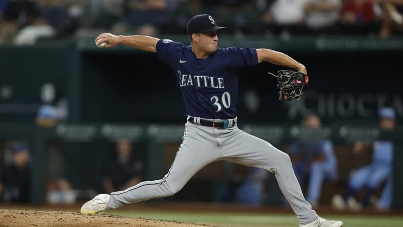 Jun 4, 2023; Arlington, Texas, USA; Seattle Mariners relief pitcher Trevor Gott (30) throws a pitch against the Seattle Mariners in the sixth inning at Globe Life Field. Mandatory Credit: Tim Heitman-USA TODAY Sports