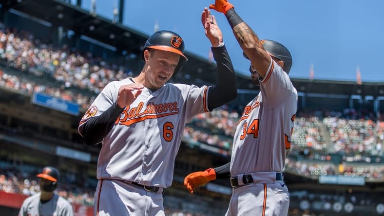 Jun 4, 2023; San Francisco, California, USA; Baltimore Orioles first baseman Ryan Mountcastle (6) is congratulated by center fielder Aaron Hicks (34) after he scored against the San Francisco Giants during the third inning at Oracle Park. Mandatory Credit: John Hefti-USA TODAY Sports