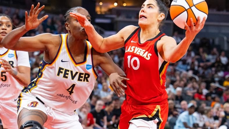 Jun 4, 2023; Indianapolis, Indiana, USA; Las Vegas Aces guard Kelsey Plum (10) shoots the ball while Indiana Fever center Queen Egbo (4) defends in the second half at Gainbridge Fieldhouse. Mandatory Credit: Trevor Ruszkowski-USA TODAY Sports