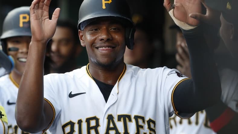 Jun 9, 2023; Pittsburgh, Pennsylvania, USA; Pittsburgh Pirates third baseman Ke'Bryan Hayes (13) high-fives in the dugout after scoring a run against the New York Mets during the second inning at PNC Park. Mandatory Credit: Charles LeClaire-USA TODAY Sports
