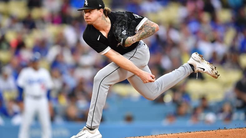 Jun 14, 2023; Los Angeles, California, USA; Chicago White Sox starting pitcher Mike Clevinger (52) throws against the Los Angeles Dodgers during the first inning at Dodger Stadium. Mandatory Credit: Gary A. Vasquez-USA TODAY Sports