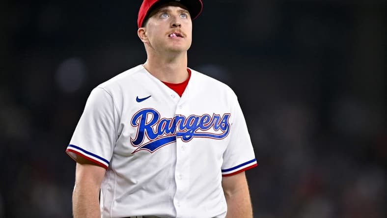 Jun 17, 2023; Arlington, Texas, USA; Texas Rangers relief pitcher Josh Sborz (66) walks off the field after pitching against the Toronto Blue Jays at Globe Life Field. Mandatory Credit: Jerome Miron-USA TODAY Sports