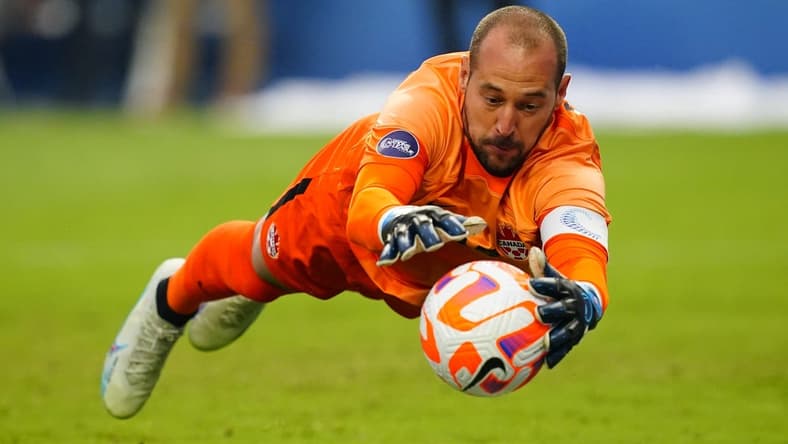 Jun 18, 2023; Las Vegas, Nevada, USA; Canada goalkeeper Milan Borjan (18) makes a save during the first half against the USA at Allegiant Stadium. Mandatory Credit: Lucas Peltier-USA TODAY Sports