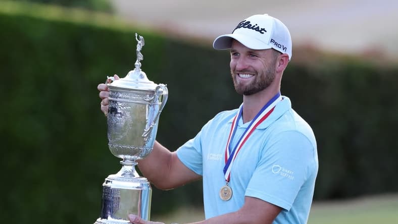 Jun 18, 2023; Los Angeles, California, USA; Wyndham Clark celebrates with the championship trophy after winning the U.S. Open golf tournament at Los Angeles Country Club. Mandatory Credit: Kiyoshi Mio-USA TODAY Sports