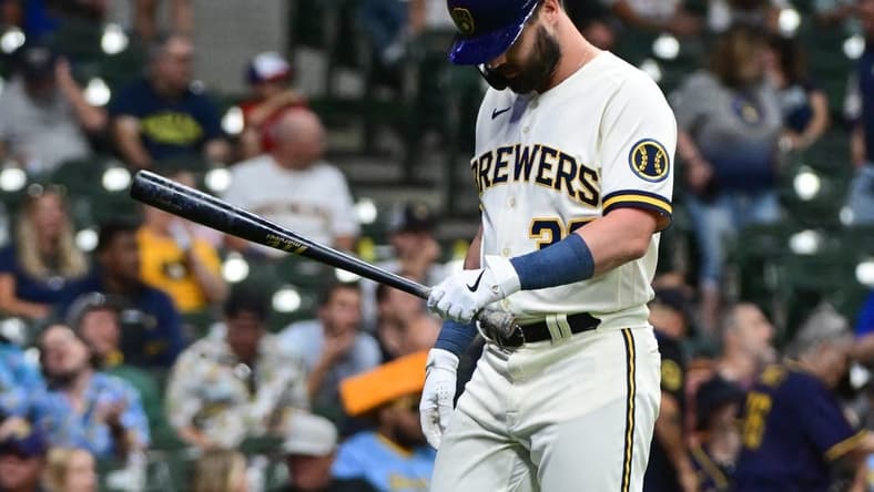 Jun 19, 2023; Milwaukee, Wisconsin, USA; Milwaukee Brewers designated hitter Jesse Winker (33) walks back to the dugout after striking out in the sixth inning against the Arizona Diamondbacks at American Family Field. Mandatory Credit: Benny Sieu-USA TODAY Sports