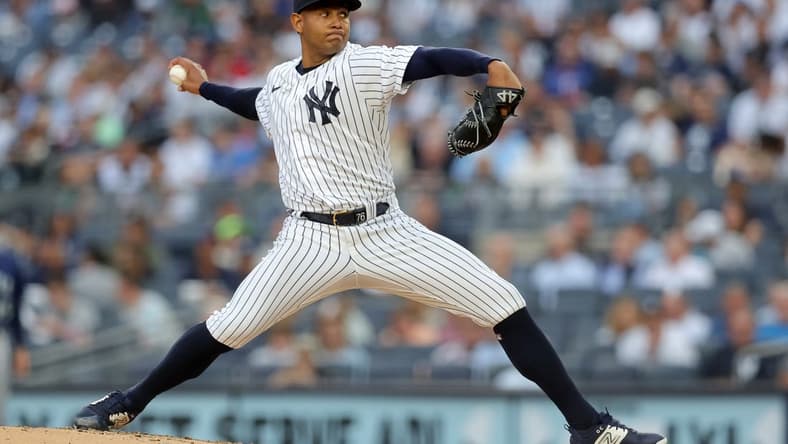 Jun 21, 2023; Bronx, New York, USA; New York Yankees starting pitcher Jhony Brito (76) pitches against Seattle Mariners during the second inning at Yankee Stadium. Mandatory Credit: Brad Penner-USA TODAY Sports
