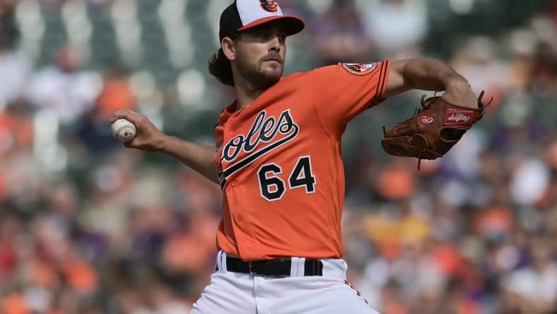 Jun 24, 2023; Baltimore, Maryland, USA;  Baltimore Orioles starting pitcher Dean Kremer (64) throws a second inning pitch against the Seattle Mariners at Oriole Park at Camden Yards. Mandatory Credit: Tommy Gilligan-USA TODAY Sports