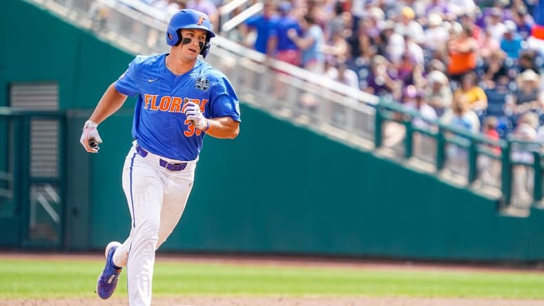 Jun 25, 2023; Omaha, NE, USA; Florida Gators center fielder Wyatt Langford (36) rounds the bases after hitting a three-run home run against the LSU Tigers during the sixth inning at Charles Schwab Field Omaha. Mandatory Credit: Dylan Widger-USA TODAY Sports
