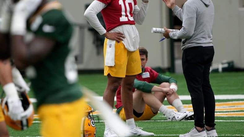 Green Bay Packers head coach Matt LaFleur talks with quarterback Jordan Love (10) during organized team activities Tuesday, May 23, 2023 in Green Bay, Wis.