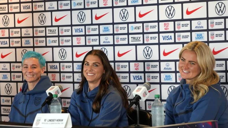 Jun 27, 2023; Carson, California, USA; USWNT forward Megan Rapinoe (left), forward Alex Morgan (center) and midfielder Lindsey Horan during Women's World Cup media day at Dignity Health Sports Park. Mandatory Credit: Kirby Lee-USA TODAY Sports