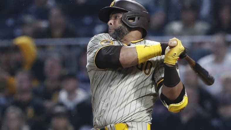 Jun 27, 2023; Pittsburgh, Pennsylvania, USA; San Diego Padres designated hitter Nelson Cruz (32) hits a RBI single against the Pittsburgh Pirates during the sixth inning at PNC Park. Mandatory Credit: Charles LeClaire-USA TODAY Sports