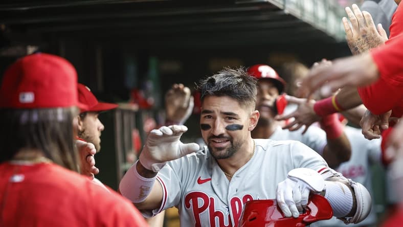 Jun 28, 2023; Chicago, Illinois, USA; Philadelphia Phillies right fielder Nick Castellanos (8) celebrates with teammates after hitting a three-run home run against the Chicago Cubs during the second inning at Wrigley Field. Mandatory Credit: Kamil Krzaczynski-USA TODAY Sports