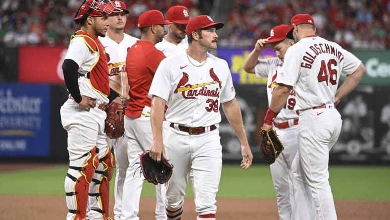 Jun 28, 2023; St. Louis, Missouri, USA; St. Louis Cardinals starting pitcher Miles Mikolas (39) walks off the field after being pulled by St. Louis Cardinals manager Oliver Marmol (37) in the sixth inning against the Houston Astros at Busch Stadium. Mandatory Credit: Joe Puetz-USA TODAY Sports