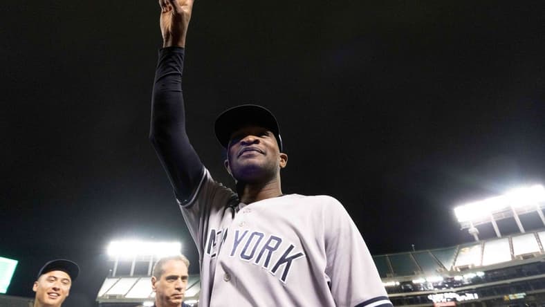 Jun 28, 2023; Oakland, California, USA;  New York Yankees starting pitcher Domingo German (0) acknowledges fans after pitching a perfect game against the Oakland Athletics at Oakland-Alameda County Coliseum. It was the first perfect game in MLB since 2012 and the fourth perfect game in franchise history. Mandatory Credit: Stan Szeto-USA TODAY Sports