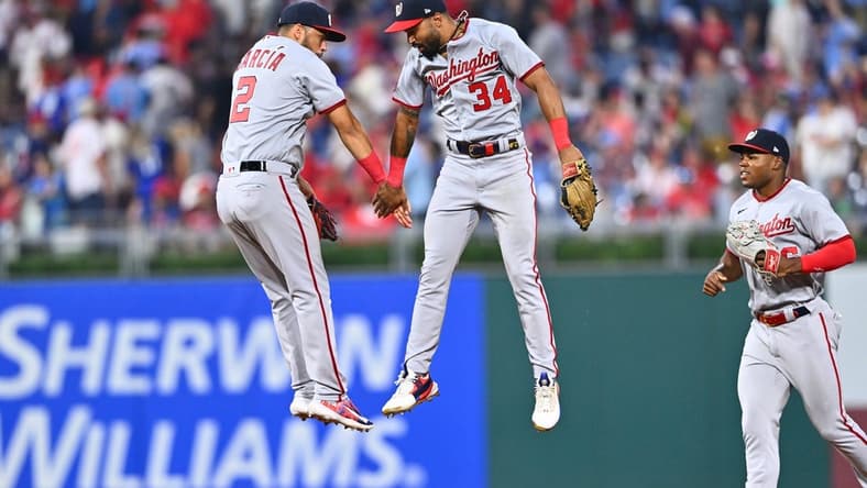 Jun 30, 2023; Philadelphia, Pennsylvania, USA; Washington Nationals second baseman Luis Garcia (2) and outfielder Derek Hill (34) celebrate after the game against the Philadelphia Phillies at Citizens Bank Park. Mandatory Credit: Kyle Ross-USA TODAY Sports