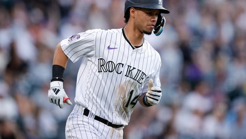 Jun 30, 2023; Denver, Colorado, USA; Colorado Rockies shortstop Ezequiel Tovar (14) rounds the bases on a three run home run in the sixth inning against the Detroit Tigers at Coors Field. Mandatory Credit: Isaiah J. Downing-USA TODAY Sports