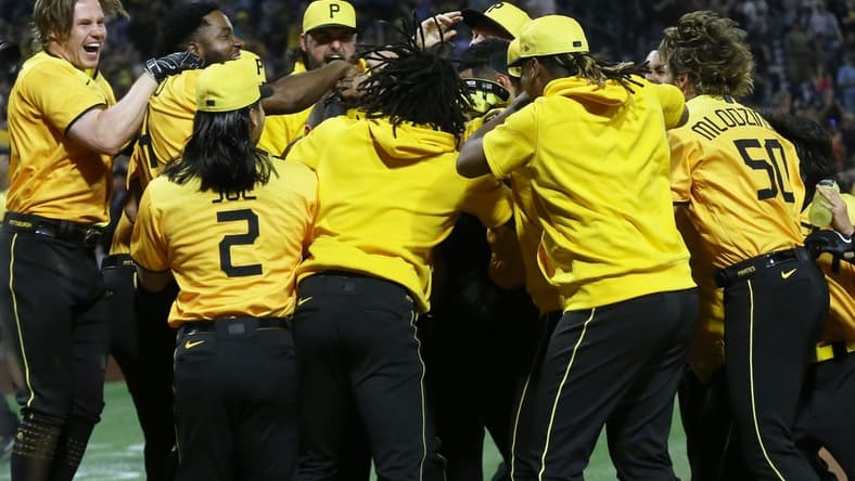 Jun 30, 2023; Pittsburgh, Pennsylvania, USA; The Pittsburgh Pirates celebrate a walk-off two-run home run by first baseman Carlos Santana (hidden) to defeat the Milwaukee Brewers at PNC Park. Mandatory Credit: Charles LeClaire-USA TODAY Sports