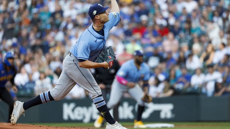 Jun 30, 2023; Seattle, Washington, USA; Tampa Bay Rays starting pitcher Shane McClanahan (18) throws against the Seattle Mariners during the first inning at T-Mobile Park. Mandatory Credit: Joe Nicholson-USA TODAY Sports