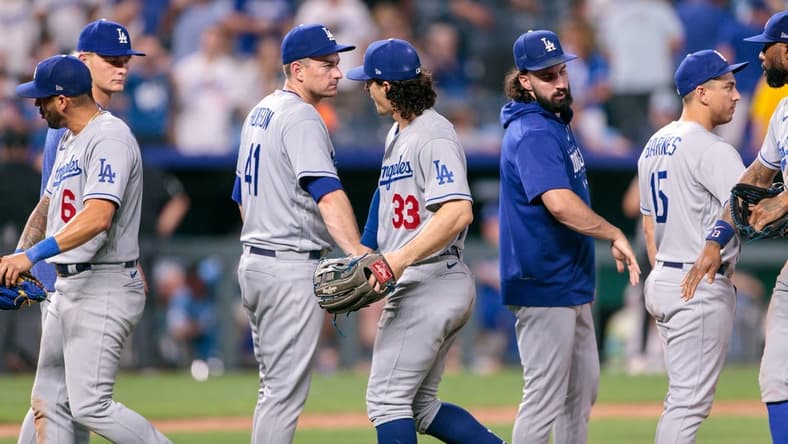 Jun 30, 2023; Kansas City, Missouri, USA; Los Angeles Dodgers congratulate one another after winning the game against the Kansas City Royals at Kauffman Stadium. Mandatory Credit: William Purnell-USA TODAY Sports