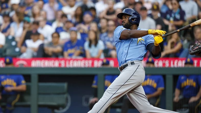 Jun 30, 2023; Seattle, Washington, USA; Tampa Bay Rays left fielder Randy Arozarena (56) hits a two-run home run against the Seattle Mariners during the fourth inning at T-Mobile Park. Mandatory Credit: Joe Nicholson-USA TODAY Sports