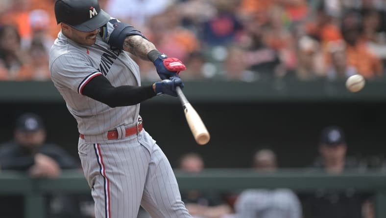 Jul 1, 2023; Baltimore, Maryland, USA; Minnesota Twins shortstop Carlos Correa (4) singles to right field during the third inning against the Baltimore Orioles at Oriole Park at Camden Yards. Mandatory Credit: Tommy Gilligan-USA TODAY Sports