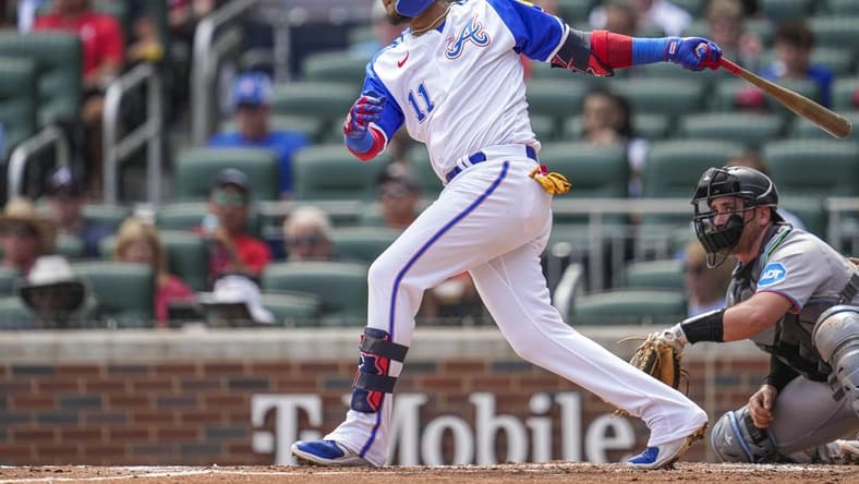 Jul 1, 2023; Cumberland, Georgia, USA; Atlanta Braves shortstop Orlando Arcia (11) doubles to drive in a run against the Miami Marlins during the first inning at Truist Park. Mandatory Credit: Dale Zanine-USA TODAY Sports