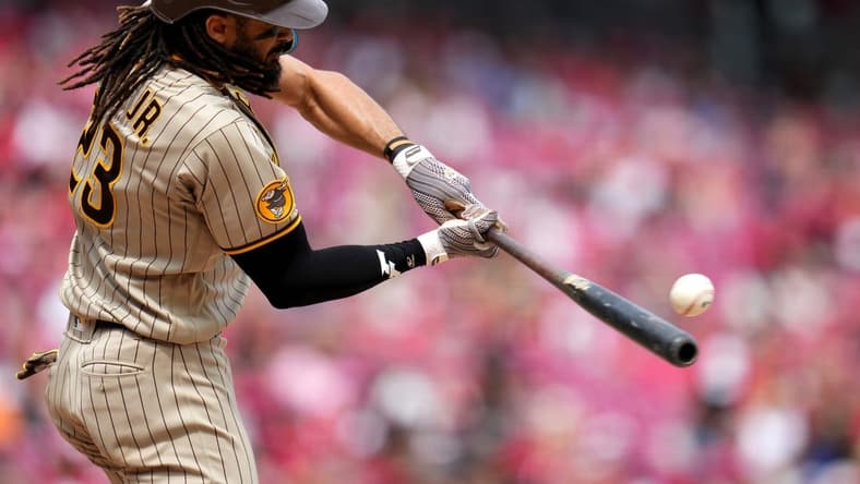 San Diego Padres right fielder Fernando Tatis Jr. (23) hits a sacrifice fly in the eighth inning during a baseball game between the San Diego Padres and the Cincinnati Reds, Saturday, July 1, 2023, at Great American Ball Park in Cincinnati.