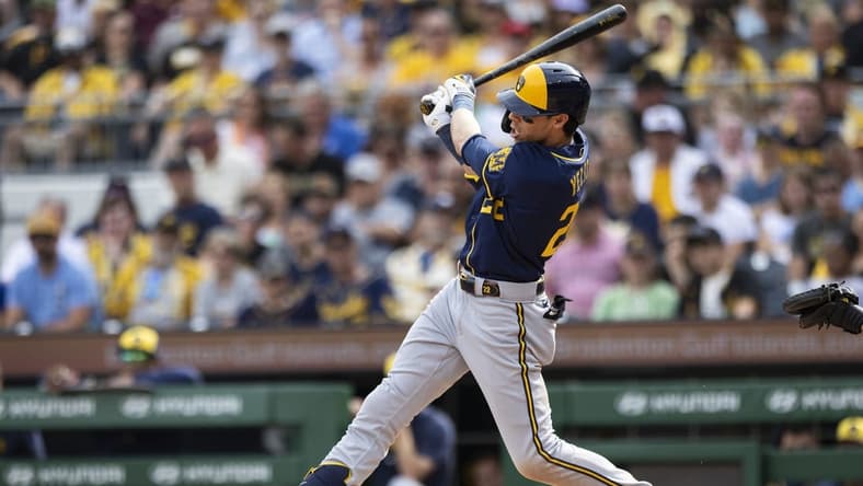 Jul 1, 2023; Pittsburgh, Pennsylvania, USA; Milwaukee Brewers left fielder Christian Yelich (22) hits a three-run home run during the second inning against the Pittsburgh Pirates at PNC Park. Mandatory Credit: Scott Galvin-USA TODAY Sports