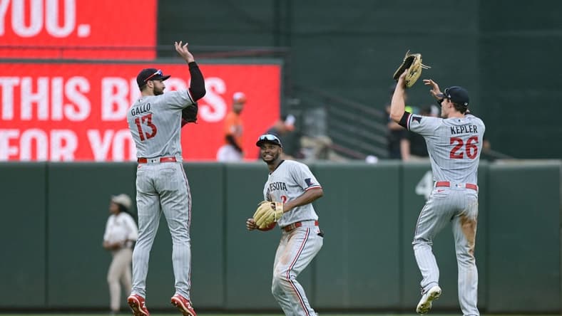 Jul 1, 2023; Baltimore, Maryland, USA; Minnesota Twins first baseman Joey Gallo (13),  center fielder Michael A. Taylor (2) and  right fielder Max Kepler (26) celebrate after the game against the Baltimore Orioles  at Oriole Park at Camden Yards. Mandatory Credit: Tommy Gilligan-USA TODAY Sports