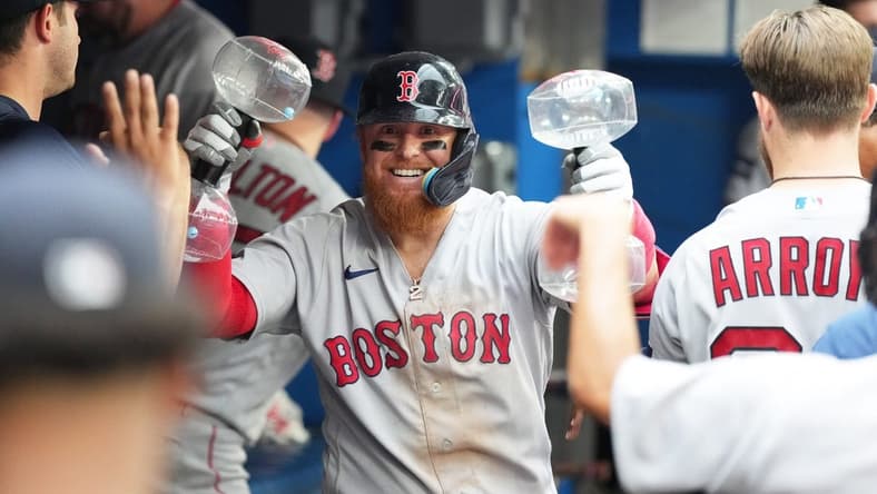Jul 1, 2023; Toronto, Ontario, CAN; Boston Red Sox designated hitter Justin Turner (2) celebrates in the dugout after hitting a home run against the Toronto Blue Jays during the ninth inning at Rogers Centre. Mandatory Credit: Nick Turchiaro-USA TODAY Sports