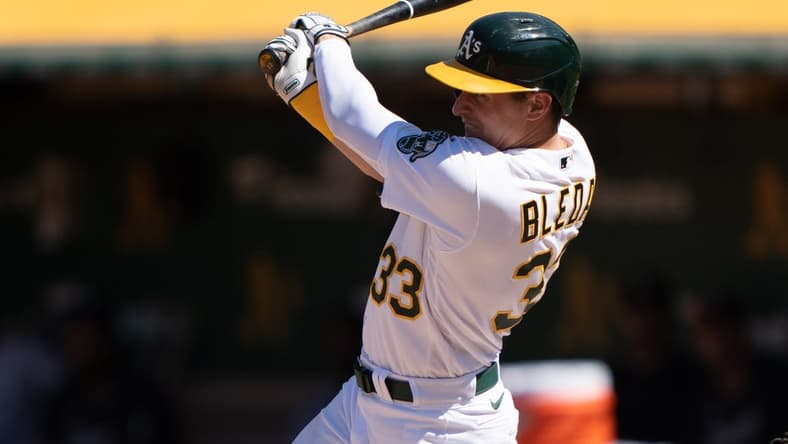 Jul 1, 2023; Oakland, California, USA; Oakland Athletics left fielder JJ Bleday (33) hits a single during the eighth inning against the Chicago White Sox at Oakland-Alameda County Coliseum. Mandatory Credit: Stan Szeto-USA TODAY Sports