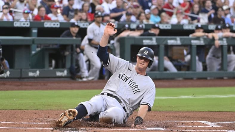 Jul 1, 2023; St. Louis, Missouri, USA; New York Yankees designated hitter DJ LeMahieu (26) slides in safely to home plate for a run against the St. Louis Cardinals in the first inning in game two of a double header at Busch Stadium. Mandatory Credit: Joe Puetz-USA TODAY Sports