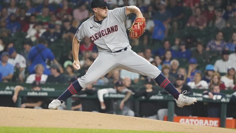 Jul 1, 2023; Chicago, Illinois, USA; Cleveland Guardians starting pitcher Tanner Bibee (61) throws the ball against the Chicago Cubs during the first inning at Wrigley Field. Mandatory Credit: David Banks-USA TODAY Sports