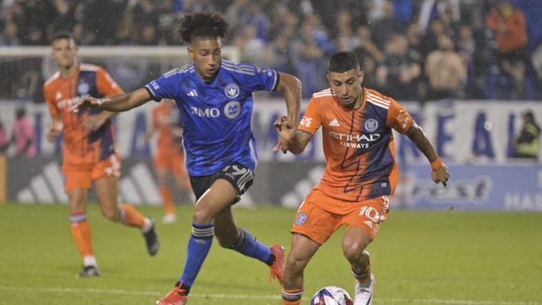 Jul 1, 2023; Montreal, Quebec, CAN; New York City FC midfielder Santiago Rodriguez (10) plays the ball defended by CF Montreal midfielder Nathan-Dylan Saliba (19) in the second half at Stade Saputo. Mandatory Credit: Eric Bolte-USA TODAY Sports
