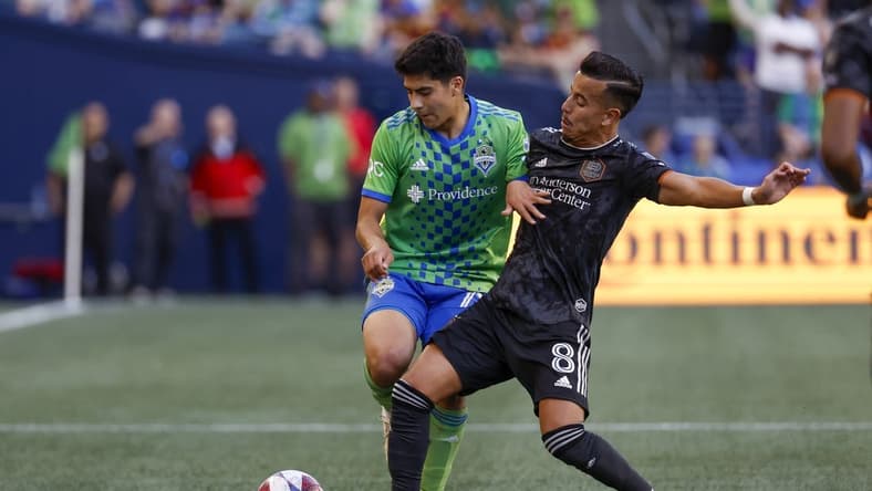 Jul 1, 2023; Seattle, Washington, USA; Houston Dynamo midfielder Amine Bassi (8) steals the ball from Seattle Sounders FC midfielder Obed Vargas (73) during the first half at Lumen Field. Mandatory Credit: Joe Nicholson-USA TODAY Sports