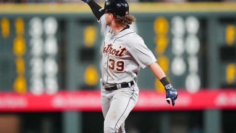 Jul 1, 2023; Denver, Colorado, USA; Detroit Tigers left fielder Zach McKinstry (39) celebrates his three run home run in the tenth inning against the Colorado Rockies at Coors Field. Mandatory Credit: Ron Chenoy-USA TODAY Sports
