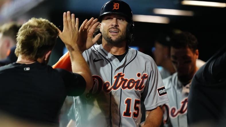 Jul 1, 2023; Denver, Colorado, USA; Detroit Tigers right fielder Jake Marisnick (15) celebrates scoring a run in the seventh inning against the Colorado Rockies at Coors Field. Mandatory Credit: Ron Chenoy-USA TODAY Sports
