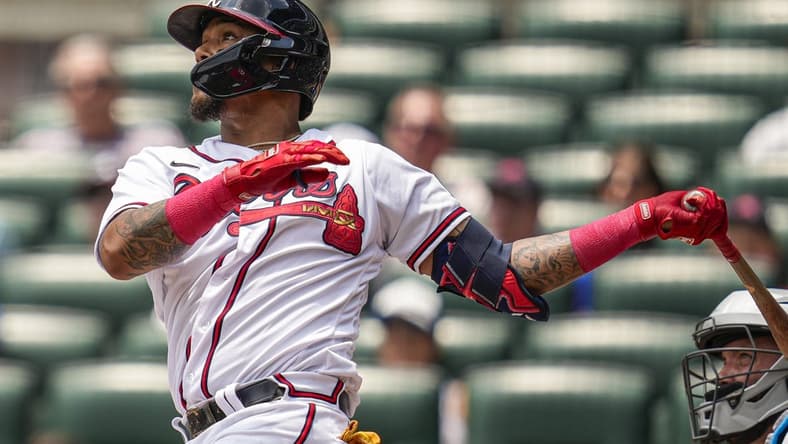 Jul 2, 2023; Cumberland, Georgia, USA; Atlanta Braves shortstop Orlando Arcia (11) watches the ball after hitting a home run against the Miami Marlins during the second inning at Truist Park. Mandatory Credit: Dale Zanine-USA TODAY Sports