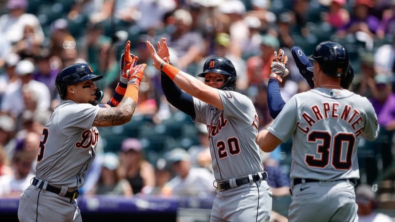 Jul 2, 2023; Denver, Colorado, USA; Detroit Tigers shortstop Javier Baez (28) celebrates his grand slam with first baseman Spencer Torkelson (20) and designated hitter Zach McKinstry (39) and right fielder Kerry Carpenter (30) in the first inning against the Colorado Rockies at Coors Field. Mandatory Credit: Isaiah J. Downing-USA TODAY Sports