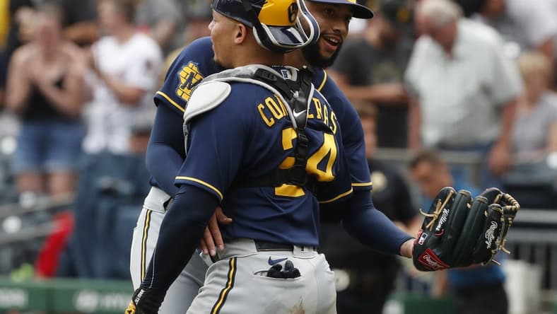 Jul 2, 2023; Pittsburgh, Pennsylvania, USA; Milwaukee Brewers relief pitcher Devin Williams (38) and catcher William Contreras (24) embrace after defeating the Pittsburgh Pirates at PNC Park. The Brewers won 6-3. Mandatory Credit: Charles LeClaire-USA TODAY Sports