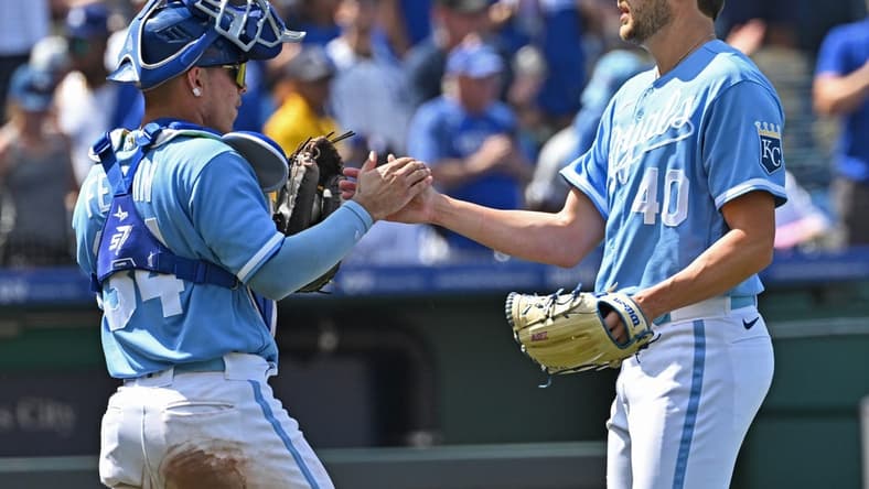 Jul 2, 2023; Kansas City, Missouri, USA;  Kansas City Royals relief pitcher Collin Snider (40) shakes hands with Kansas City Royals catcher Freddy Fermin (34) after defeating the Los Angeles Dodgers at Kauffman Stadium. Mandatory Credit: Peter Aiken-USA TODAY Sports