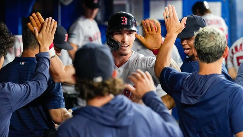 Jul 2, 2023; Toronto, Ontario, CAN; Boston Red Sox center fielder Jarren Duran (16) celebrates after scoring against the Toronto Blue Jays during the third inning at Rogers Centre. Mandatory Credit: Kevin Sousa-USA TODAY Sports