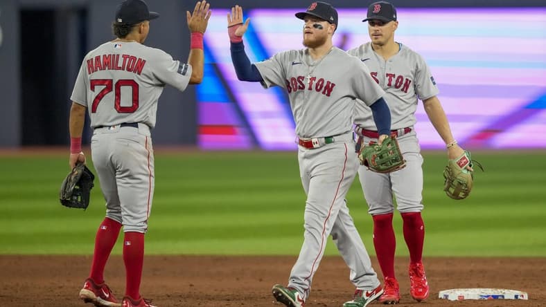 Jul 2, 2023; Toronto, Ontario, CAN; Boston Red Sox right fielder Alex Verdugo (99) and shortstop David Hamilton (70) celebrate after defeating the Toronto Blue Jays at Rogers Centre. Mandatory Credit: Kevin Sousa-USA TODAY Sports