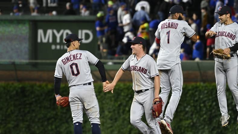 Jul 2, 2023; Chicago, Illinois, USA;  Cleveland Guardians left fielder Steven Kwan (38), right, celebrates with shortstop Amed Rosario (1) after beating the Chicago Cubs at Wrigley Field. Mandatory Credit: Matt Marton-USA TODAY Sports