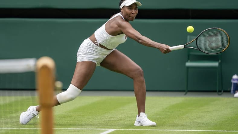 Jul 3, 2023; London, United Kingdom; Elina Svitolina (UKR) returns the ball against Venus Williams (USA) at the All England Lawn Tennis and Croquet Club. Mandatory Credit: Susan Mullane-USA TODAY Sports