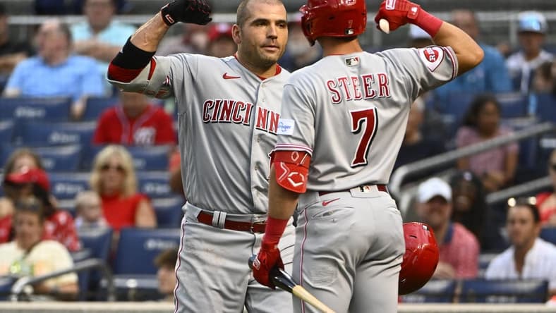 Jul 3, 2023; Washington, District of Columbia, USA; Cincinnati Reds first baseman Joey Votto (19) is congratulated by first baseman Spencer Steer (7) after hitting a two run home run against the Washington Nationals during the fourth inning at Nationals Park. Mandatory Credit: Brad Mills-USA TODAY Sports