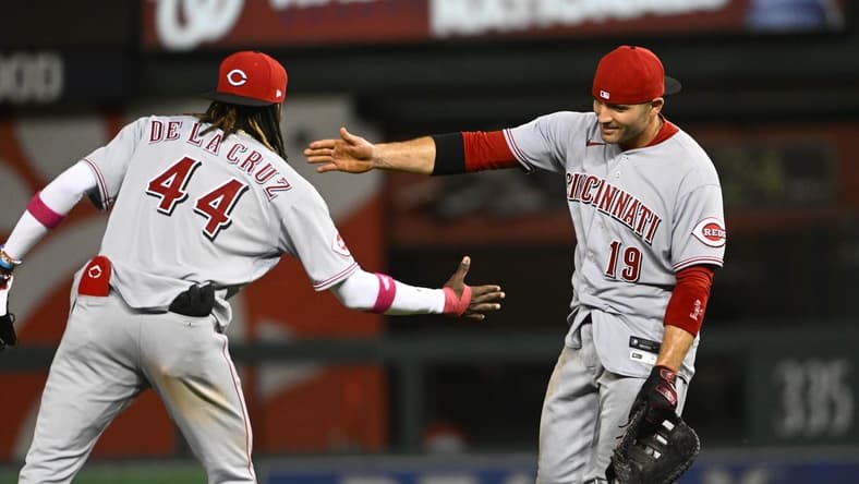 Jul 3, 2023; Washington, District of Columbia, USA; Cincinnati Reds first baseman Joey Votto (19) and shortstop Elly De La Cruz (44) celebrate after the game against the Washington Nationals at Nationals Park. Mandatory Credit: Brad Mills-USA TODAY Sports