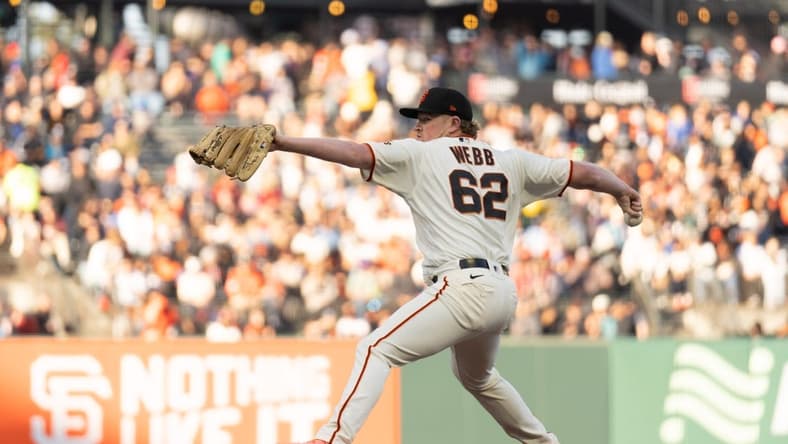 Jul 3, 2023; San Francisco, California, USA; San Francisco Giants starting pitcher Logan Webb (62) pitches during the first inning against the Seattle Mariners at Oracle Park. Mandatory Credit: Stan Szeto-USA TODAY Sports